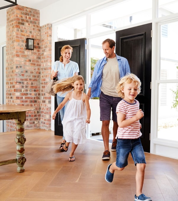 Family entering modern home